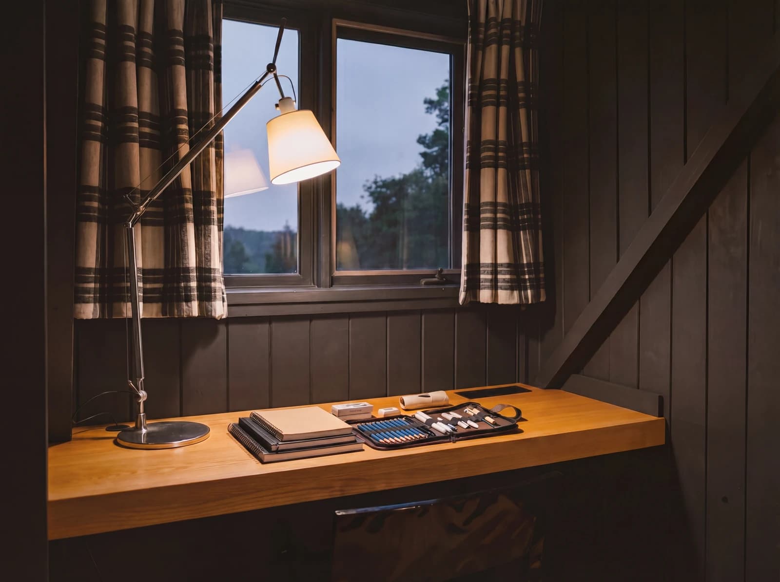 Writing desk with art supplies and adjustable lamp
