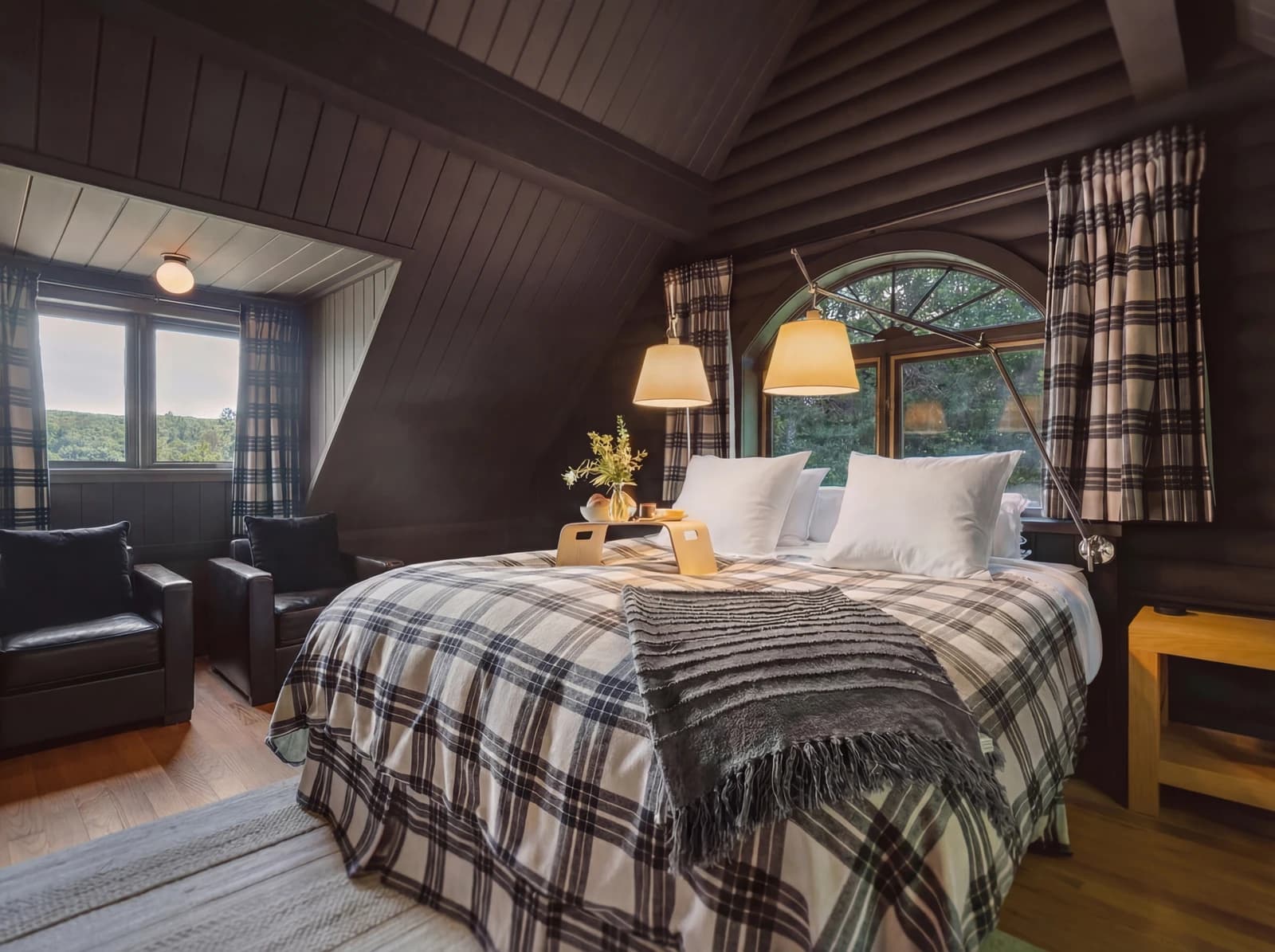 Panoramic view of upper bedroom with breakfast tray and armchairs