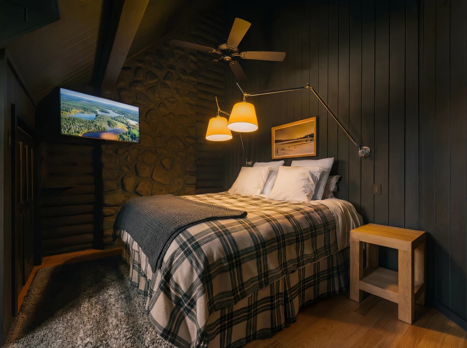Bedroom with stone accent wall and ceiling fan
