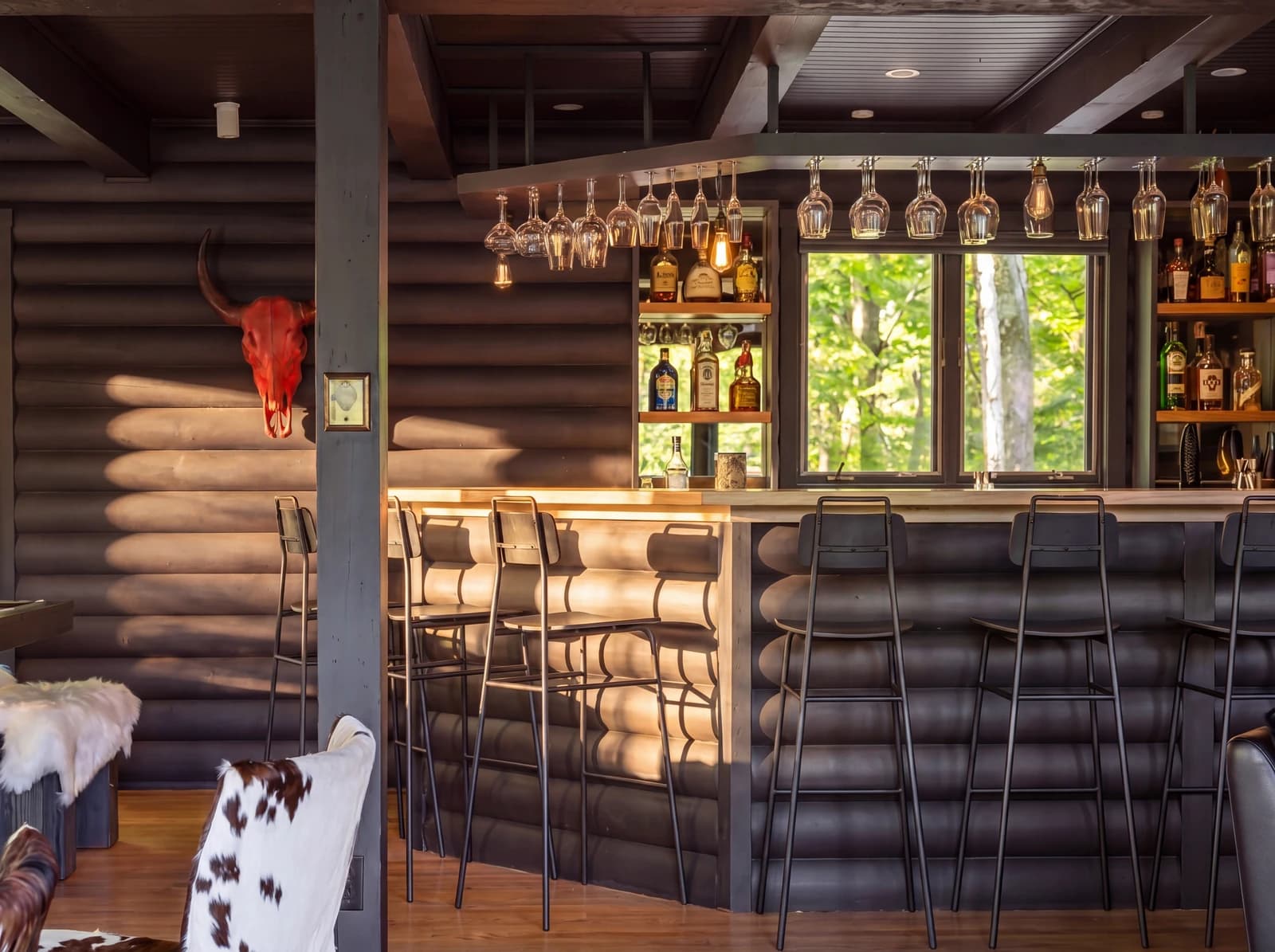 Wide bar interior with longhorn skull and hanging glasses