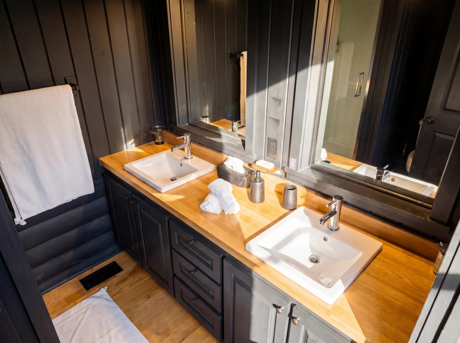 Double-vanity bathroom with dark walls